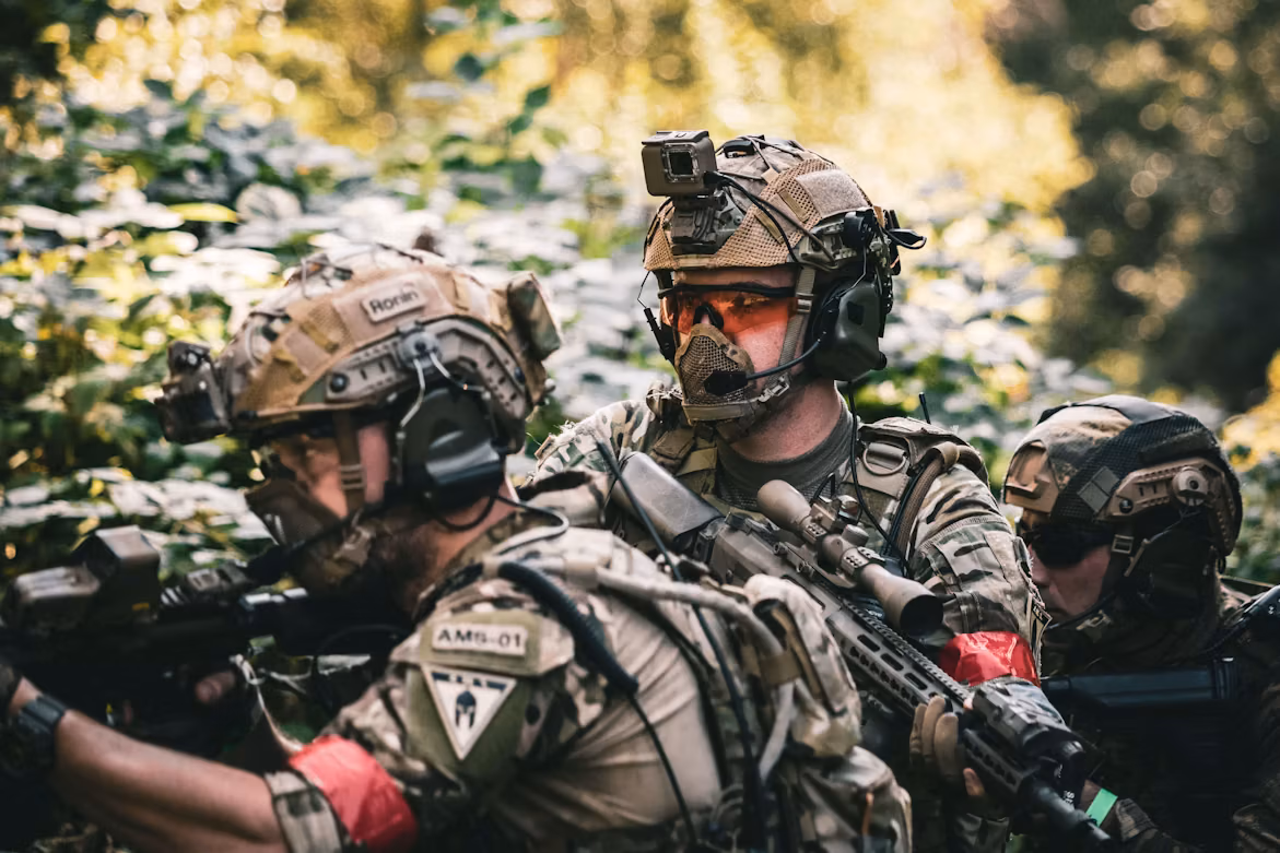 Airsoft players working together outdoors